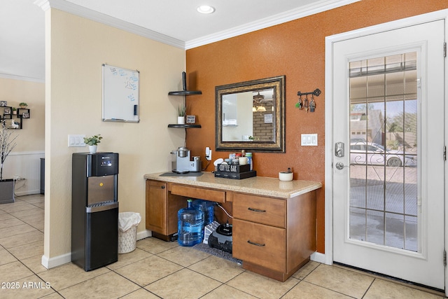 office featuring light tile patterned floors, baseboards, and ornamental molding