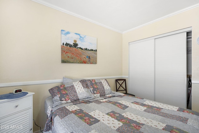 bedroom with crown molding and a closet