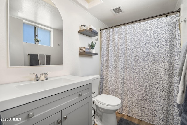 full bathroom with visible vents, toilet, wood finished floors, and vanity