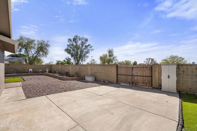 view of patio / terrace featuring a fenced backyard and a gate