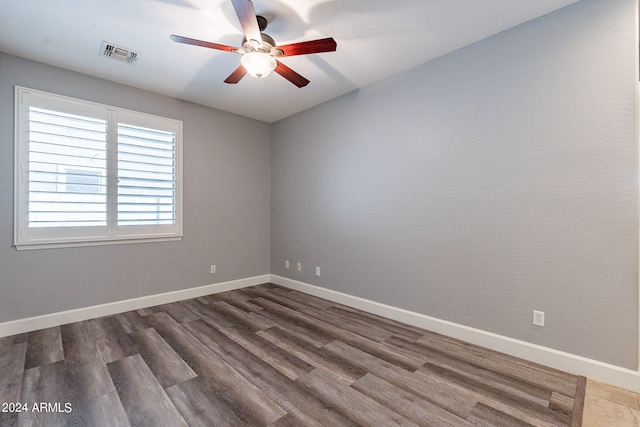 unfurnished room featuring ceiling fan and hardwood / wood-style flooring