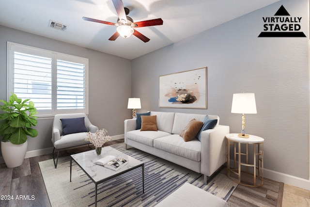 living room featuring ceiling fan and hardwood / wood-style floors