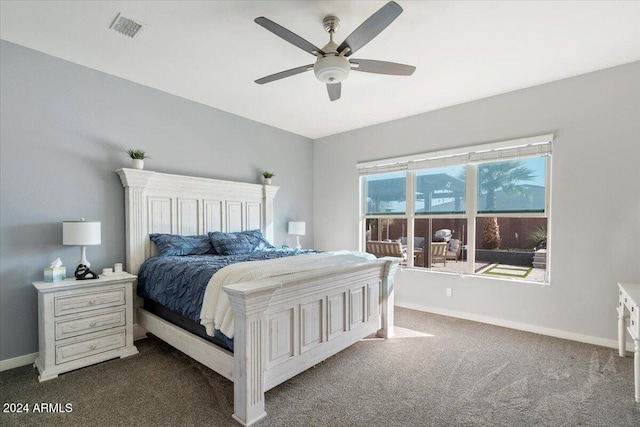 bedroom featuring ceiling fan and dark colored carpet