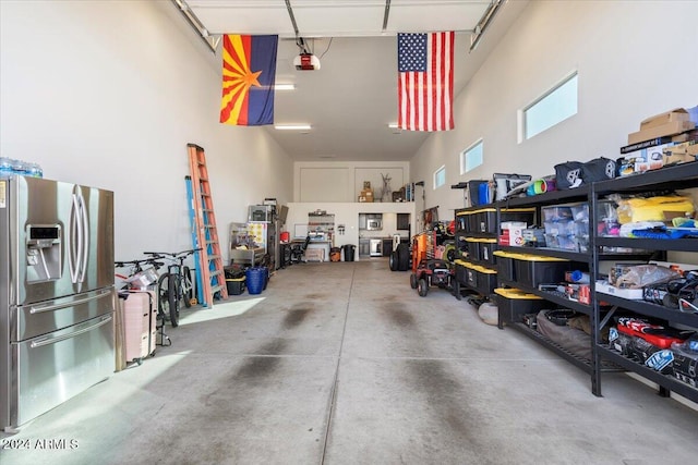 garage with stainless steel fridge