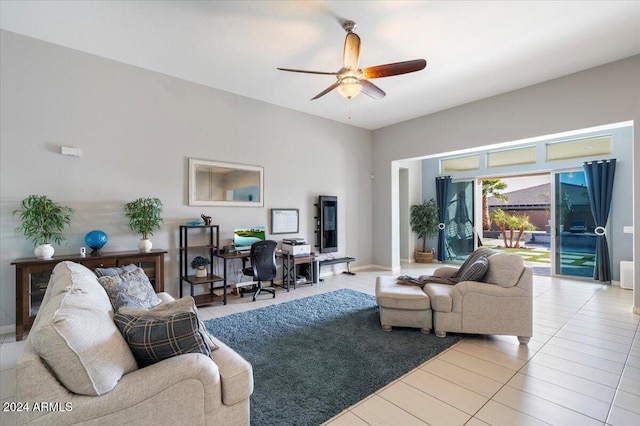 tiled living room featuring ceiling fan