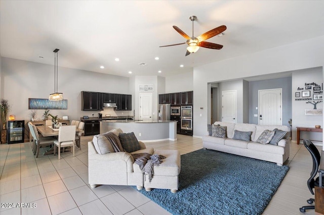 tiled living room with ceiling fan