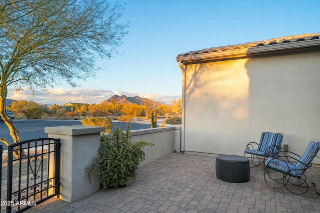 view of patio featuring a mountain view and central AC unit