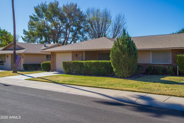 ranch-style house with a front yard and a garage