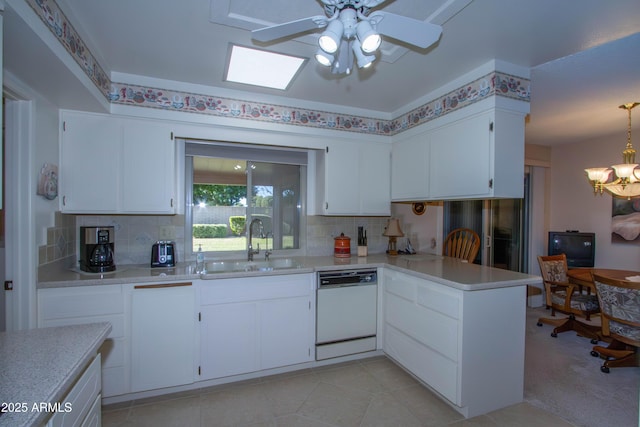 kitchen with white cabinetry, white dishwasher, decorative backsplash, and sink