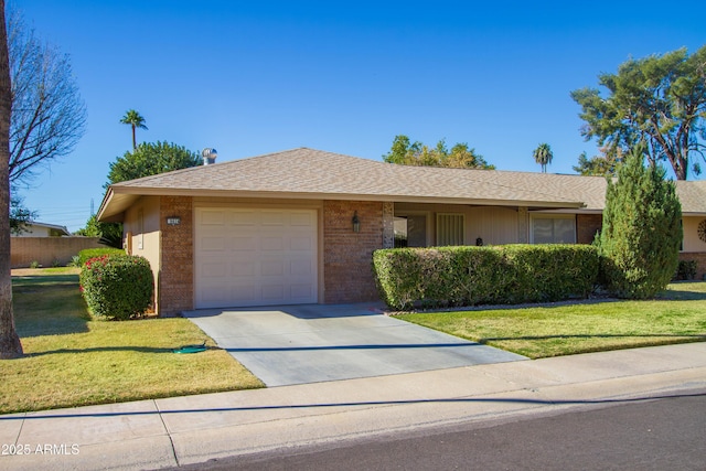 ranch-style house with a garage and a front yard