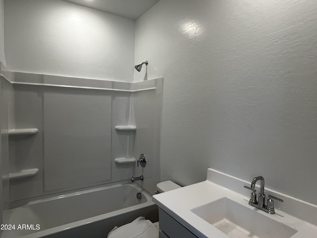 full bathroom featuring vanity,  shower combination, and toilet