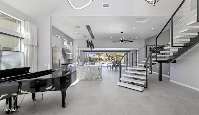 interior space featuring stairs, a ceiling fan, baseboards, recessed lighting, and visible vents