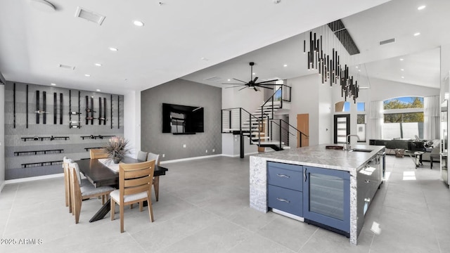 interior space featuring recessed lighting, open floor plan, visible vents, and a sink