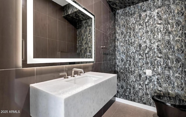bathroom with vanity, tile patterned floors, toilet, and tile walls
