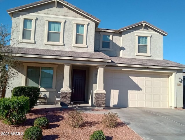 view of front of home with a garage and covered porch