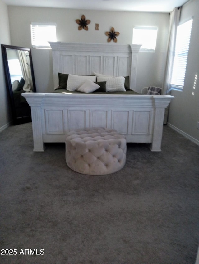 bedroom featuring dark colored carpet