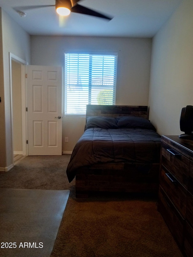 bedroom featuring ceiling fan and carpet