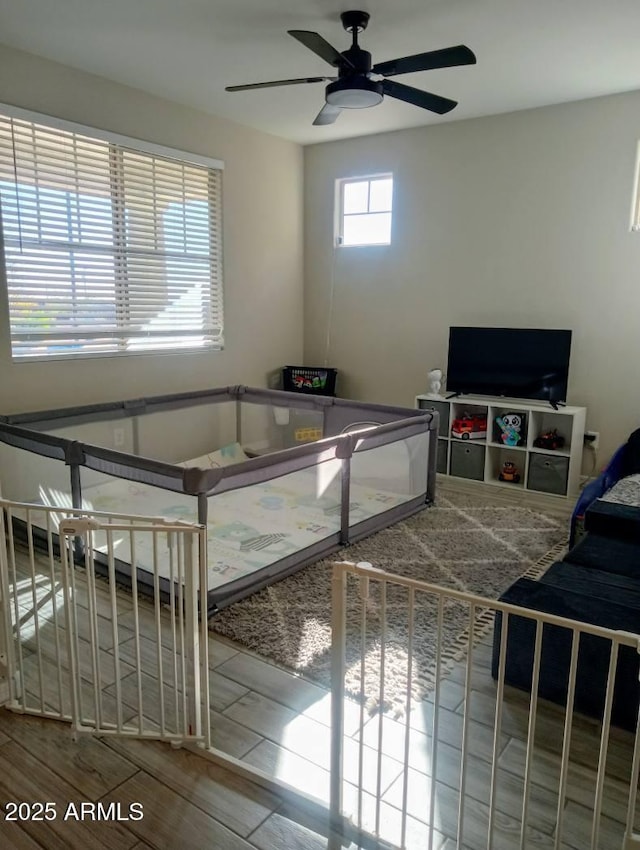 bedroom with wood-type flooring and ceiling fan