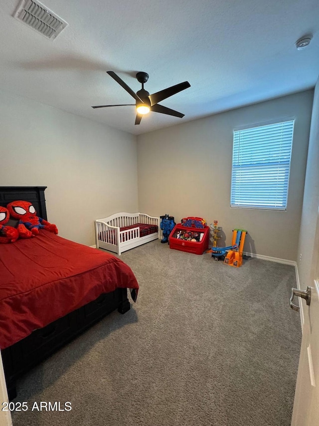 bedroom with ceiling fan and carpet