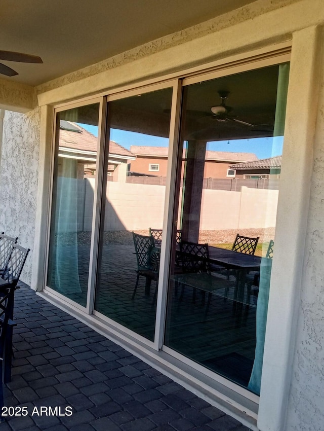 exterior space featuring ceiling fan