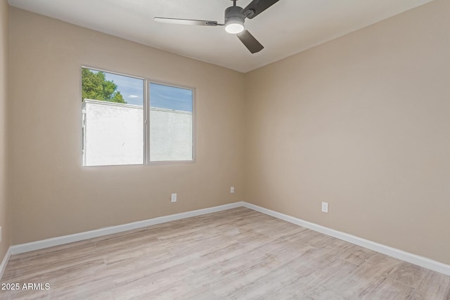 unfurnished room with ceiling fan and light hardwood / wood-style floors