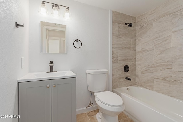 full bathroom with tiled shower / bath, tile patterned floors, toilet, and vanity