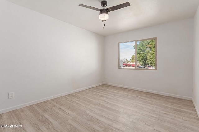 unfurnished room featuring ceiling fan and light hardwood / wood-style floors