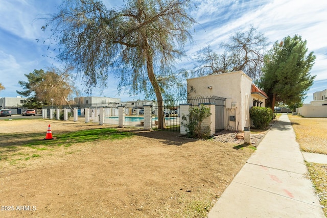 view of home's community featuring a swimming pool