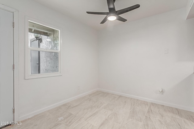 spare room with ceiling fan