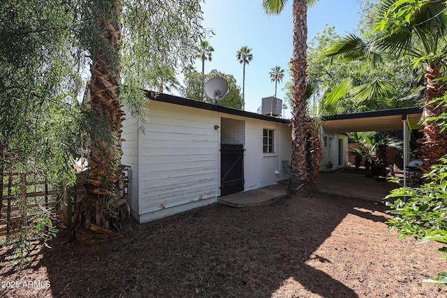 back of house featuring fence and a patio area