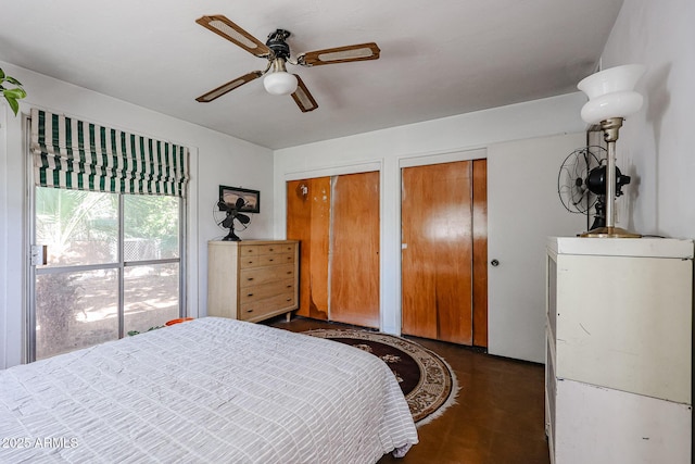 bedroom featuring two closets and ceiling fan