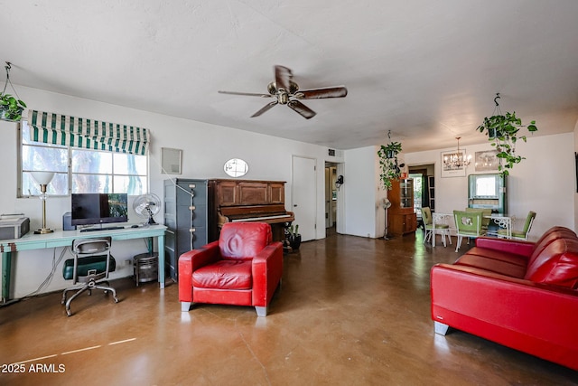 living room featuring a chandelier, finished concrete flooring, a desk, and a ceiling fan