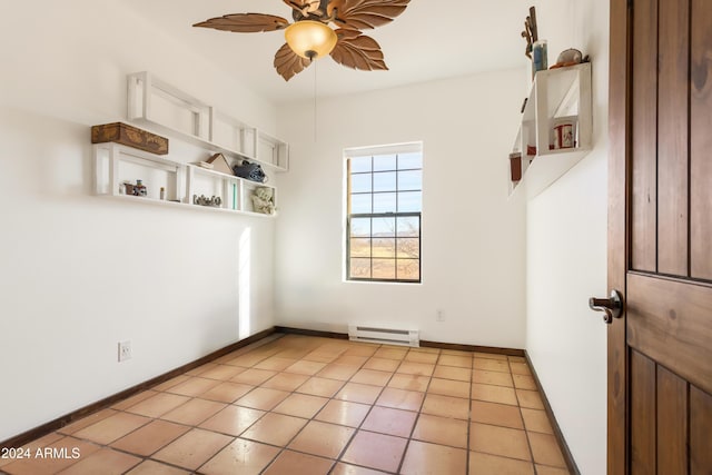 tiled empty room featuring ceiling fan and a baseboard radiator