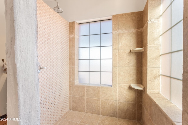 bathroom featuring tiled shower