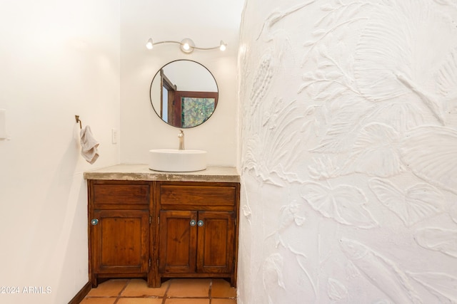 bathroom with tile patterned floors and vanity