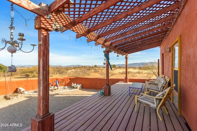 wooden deck featuring a pergola