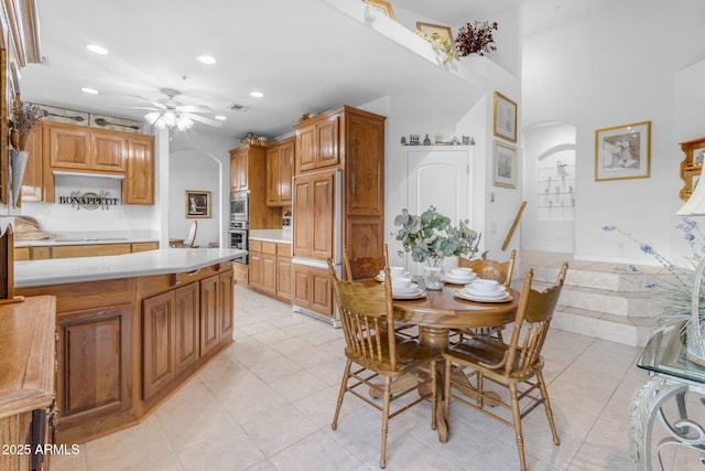 dining room with ceiling fan and light tile patterned flooring