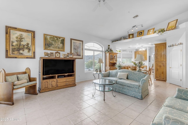 living room featuring ceiling fan, track lighting, and light tile patterned flooring