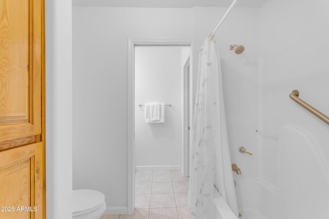 bathroom featuring toilet, tile patterned floors, and shower / bath combo