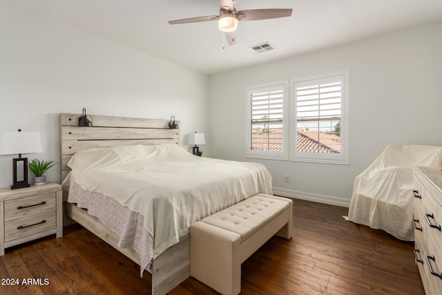 bedroom with ceiling fan and dark hardwood / wood-style flooring