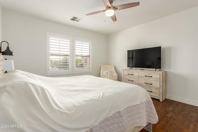 bedroom featuring dark hardwood / wood-style floors and ceiling fan