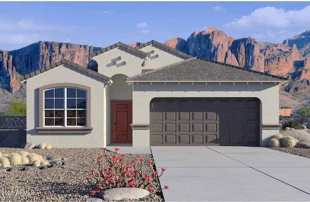 10619 W Bloch Rd, Tolleson, AZ 85353 - view of front of home featuring a mountain view, an attached garage, concrete driveway, and stucco siding