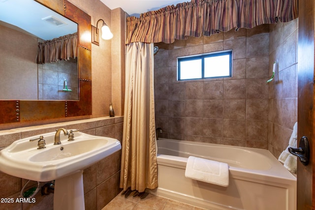 bathroom featuring shower / bathtub combination with curtain and tile patterned floors