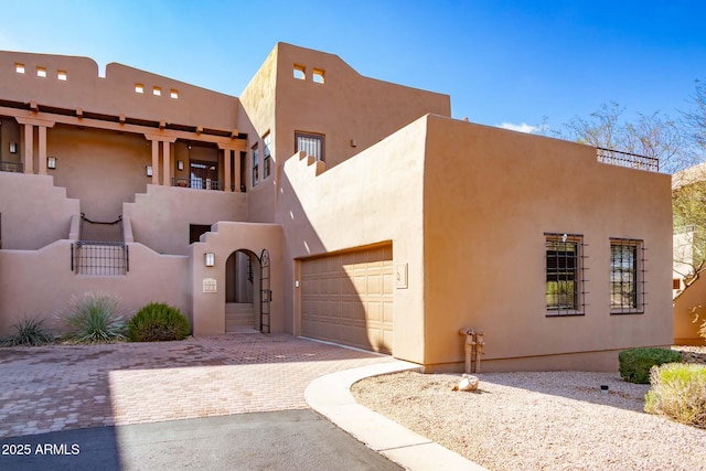 southwest-style home with a garage