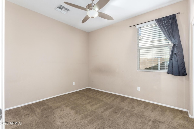 unfurnished room featuring ceiling fan and carpet