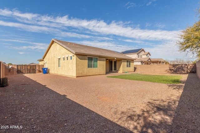 rear view of house with a patio