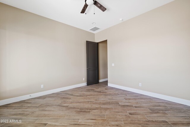 bathroom featuring vanity, toilet, and hardwood / wood-style floors