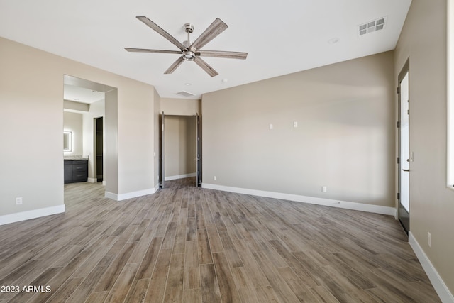 unfurnished room featuring ceiling fan and light hardwood / wood-style floors