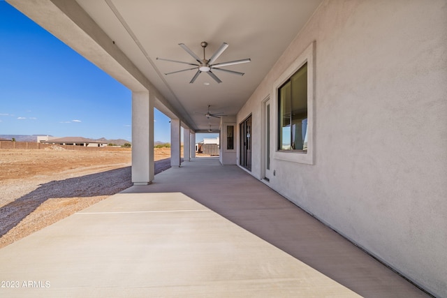 view of patio featuring ceiling fan