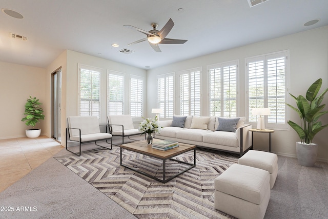 living room with ceiling fan and light tile patterned floors